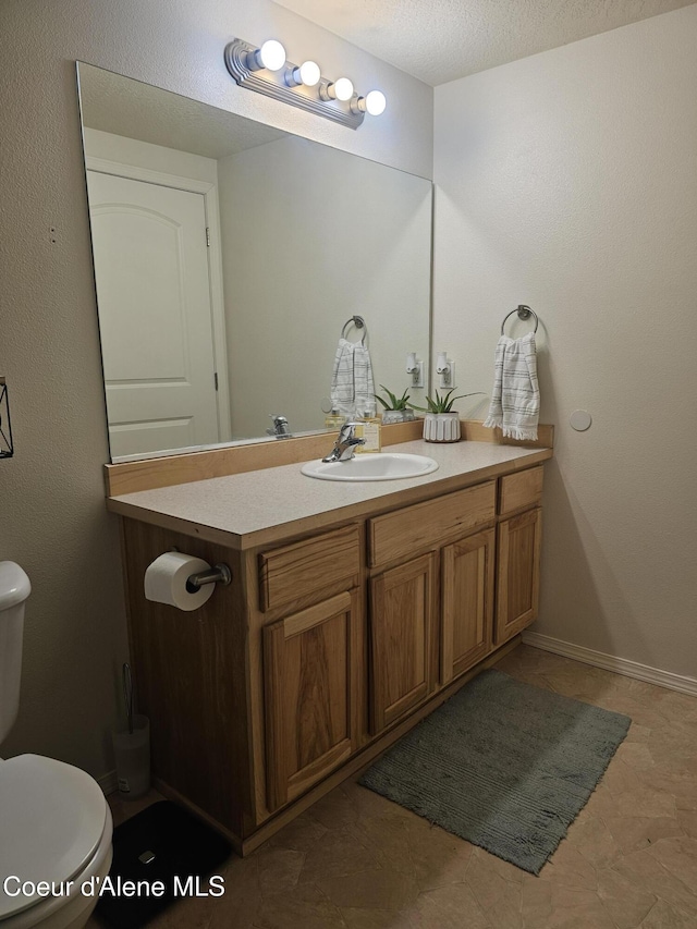 848 N Chase Rd # 102, Post Falls, ID 83854 - half bathroom featuring vanity and toilet