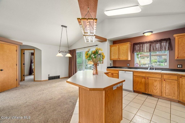 18914 W Riverview Dr, Post Falls, ID 83854 - kitchen featuring dishwasher, lofted ceiling, arched walkways, a kitchen island, and hanging light fixtures