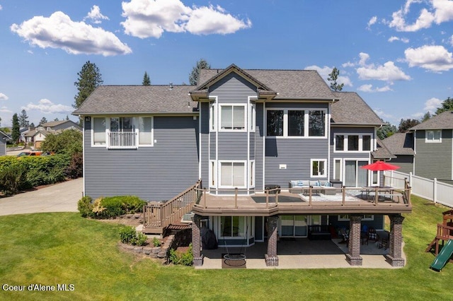 740 N Dundee Dr, Post Falls, ID 83854 - back of house featuring a patio area, an outdoor hangout area, a playground, and a wooden deck