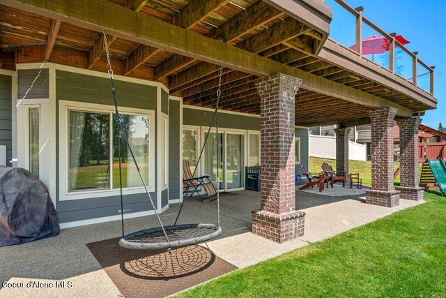 740 N Dundee Dr, Post Falls, ID 83854 - view of patio featuring a playground