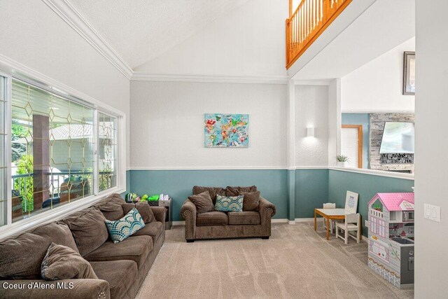 740 N Dundee Dr, Post Falls, ID 83854 - carpeted living area featuring crown molding and high vaulted ceiling