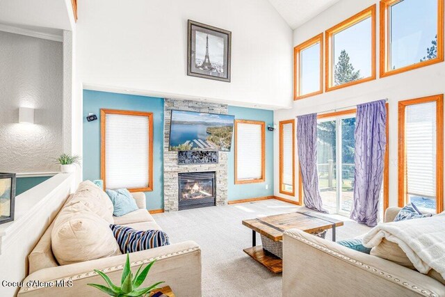 740 N Dundee Dr, Post Falls, ID 83854 - living area featuring high vaulted ceiling, carpet flooring, and a stone fireplace