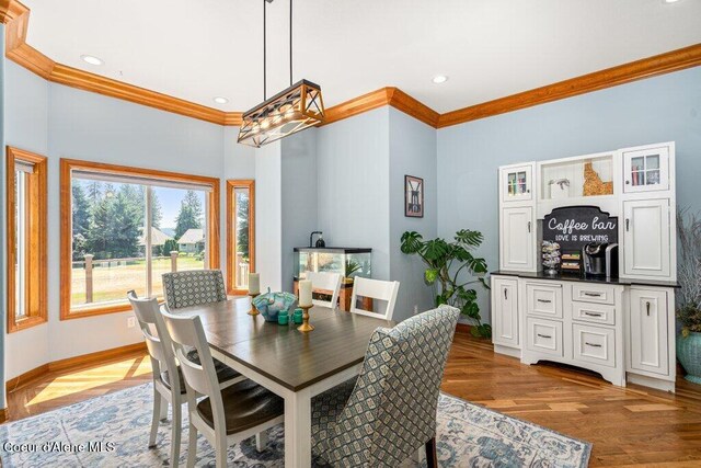 740 N Dundee Dr, Post Falls, ID 83854 - dining room with crown molding, recessed lighting, and light wood finished floors
