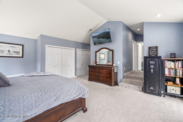 740 N Dundee Dr, Post Falls, ID 83854 - carpeted bedroom with two closets, vaulted ceiling, and recessed lighting