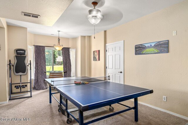 740 N Dundee Dr, Post Falls, ID 83854 - recreation room featuring carpet floors, a ceiling fan, and a textured wall