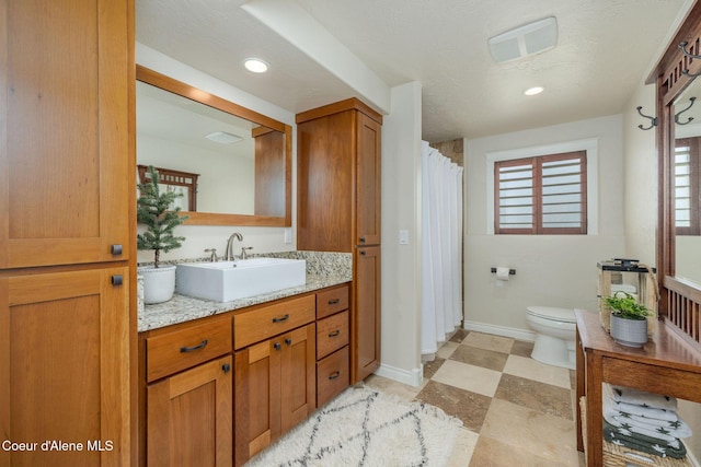8718 W Sausser Dr, Coeur Dalene, ID 83814 - bathroom featuring vanity, recessed lighting, and curtained shower