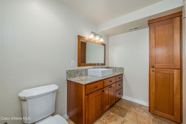 8718 W Sausser Dr, Coeur Dalene, ID 83814 - half bathroom featuring vanity and toilet