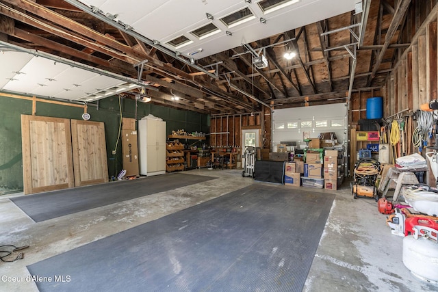 8718 W Sausser Dr, Coeur Dalene, ID 83814 - garage with a workshop area