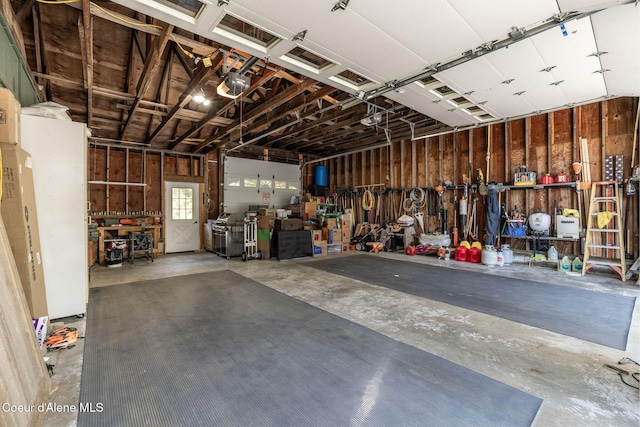8718 W Sausser Dr, Coeur Dalene, ID 83814 - garage with a workshop area