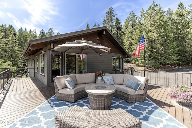 8718 W Sausser Dr, Coeur Dalene, ID 83814 - deck featuring an outdoor hangout area