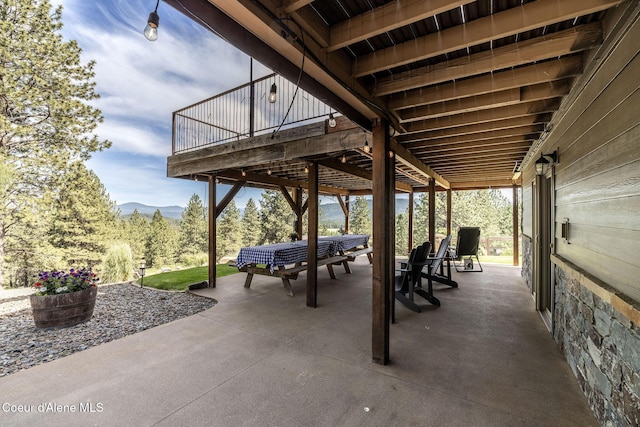 8718 W Sausser Dr, Coeur Dalene, ID 83814 - view of patio / terrace with a mountain view
