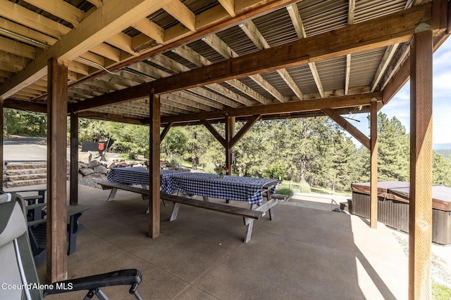 8718 W Sausser Dr, Coeur Dalene, ID 83814 - view of patio / terrace featuring a hot tub