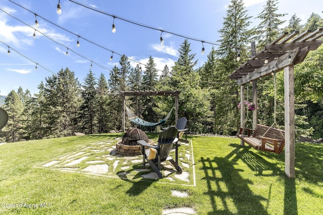 8718 W Sausser Dr, Coeur Dalene, ID 83814 - view of green lawn featuring a fire pit