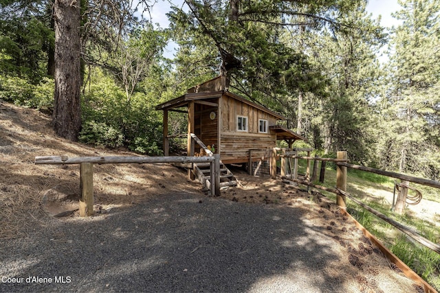 8718 W Sausser Dr, Coeur Dalene, ID 83814 - view of outdoor structure with a view of trees