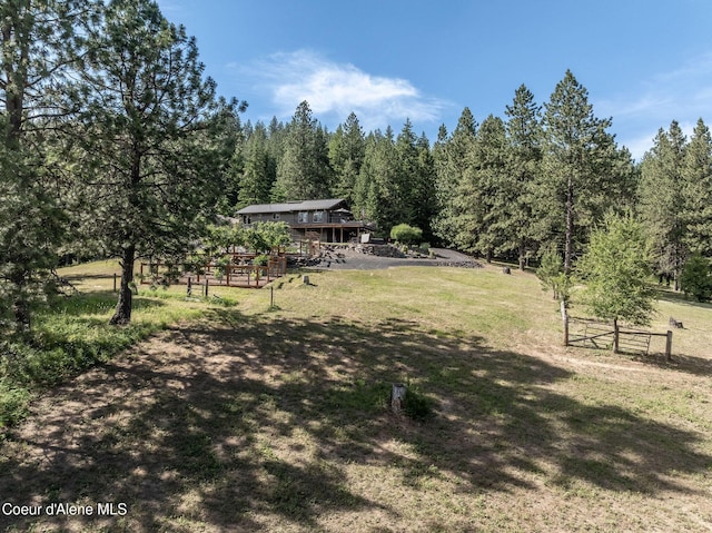 8718 W Sausser Dr, Coeur Dalene, ID 83814 - view of yard with a wooded view and a view of rural / pastoral area