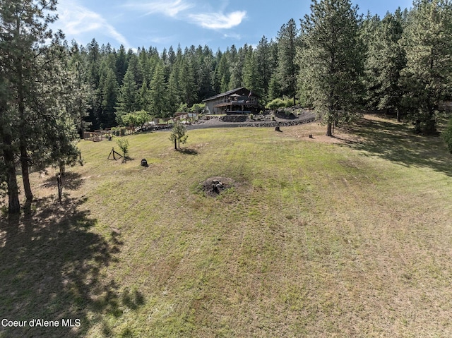 8718 W Sausser Dr, Coeur Dalene, ID 83814 - view of green lawn featuring a forest view