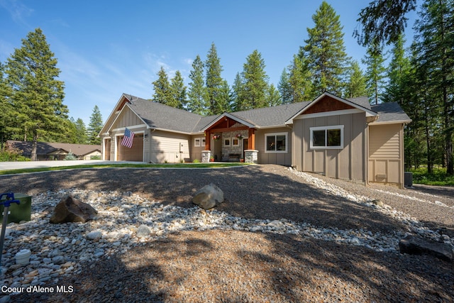 80 Parkland Dr, Blanchard, ID 83804 - view of front of home featuring board and batten siding, an attached garage, and concrete driveway