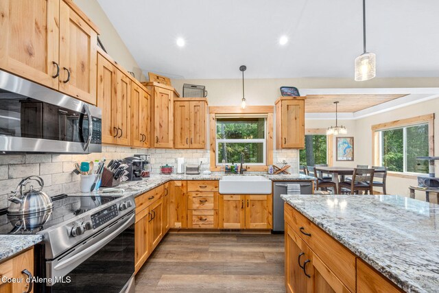 80 Parkland Dr, Blanchard, ID 83804 - kitchen with appliances with stainless steel finishes, dark wood finished floors, healthy amount of natural light, tasteful backsplash, and recessed lighting