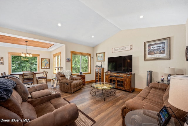 80 Parkland Dr, Blanchard, ID 83804 - living room featuring wood finished floors, plenty of natural light, vaulted ceiling, recessed lighting, and a chandelier