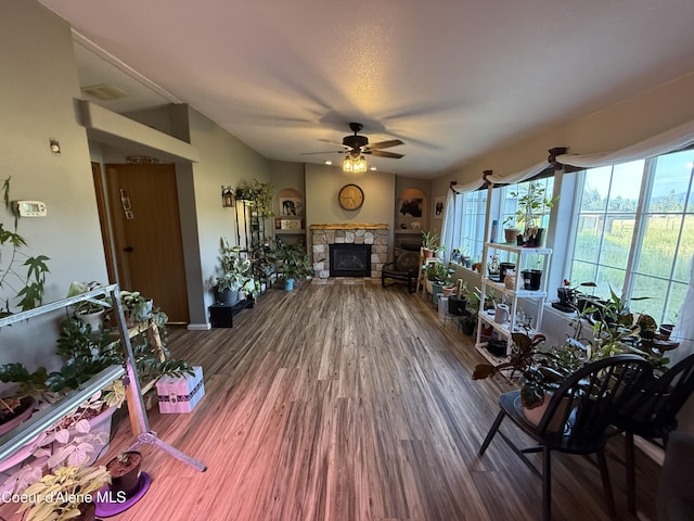 3135 Paradise Valley Rd, Bonners Ferry, ID 83805 - living room with a stone fireplace, ceiling fan, and wood finished floors