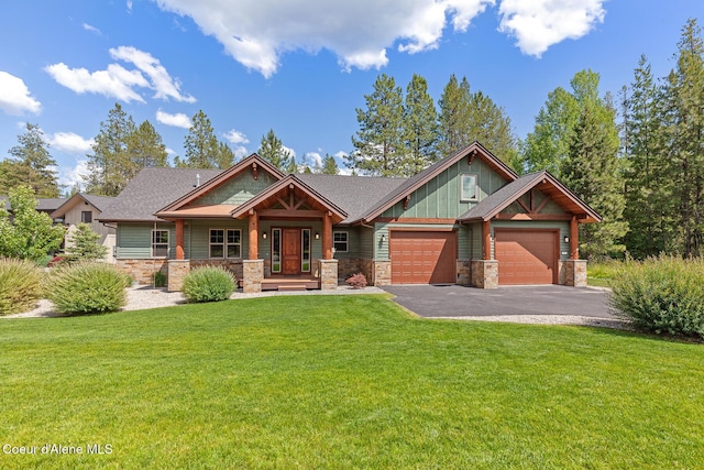 357 Odonnell Dr, Dover, ID 83825 - craftsman house with stone siding, a garage, a porch, and asphalt driveway