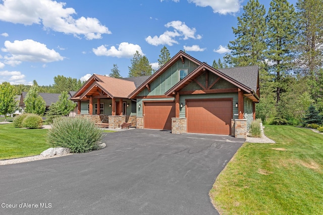 357 Odonnell Dr, Dover, ID 83825 - craftsman-style house with covered porch, stone siding, a garage, and a front lawn