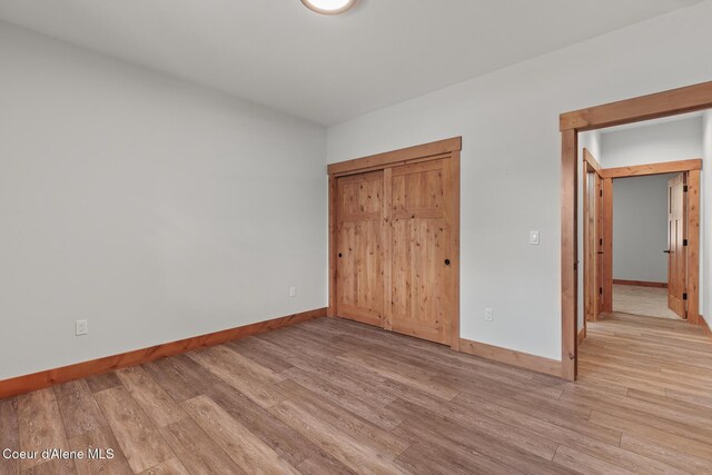 357 Odonnell Dr, Dover, ID 83825 - unfurnished bedroom featuring light wood-type flooring and a closet