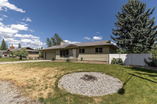 6300 N Sunrise Ter, Coeur Dalene, ID 83815 - back of property featuring a garage, driveway, and a chimney
