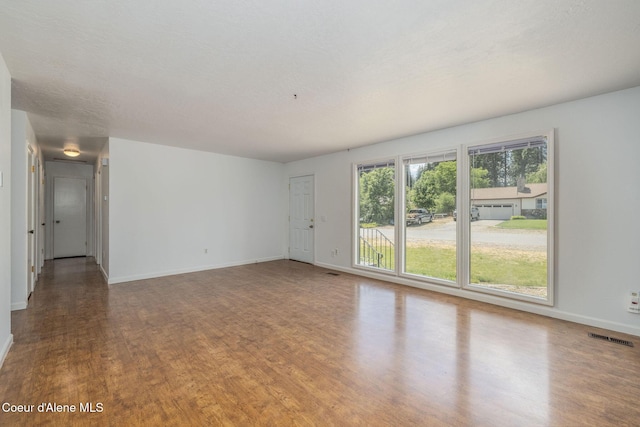 6300 N Sunrise Ter, Coeur Dalene, ID 83815 - spare room featuring wood finished floors and baseboards