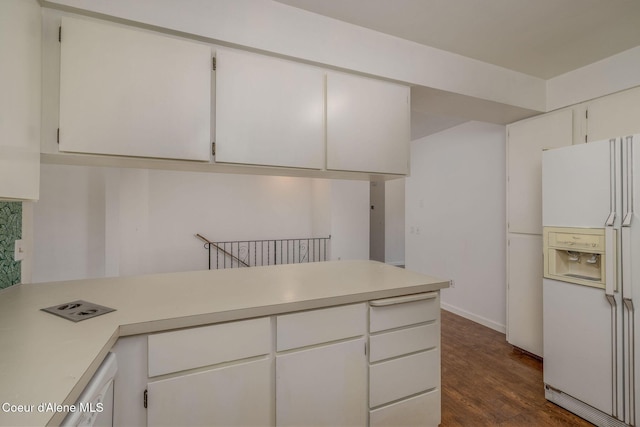 6300 N Sunrise Ter, Coeur Dalene, ID 83815 - kitchen with white refrigerator with ice dispenser, light countertops, dark wood-style flooring, and white cabinets