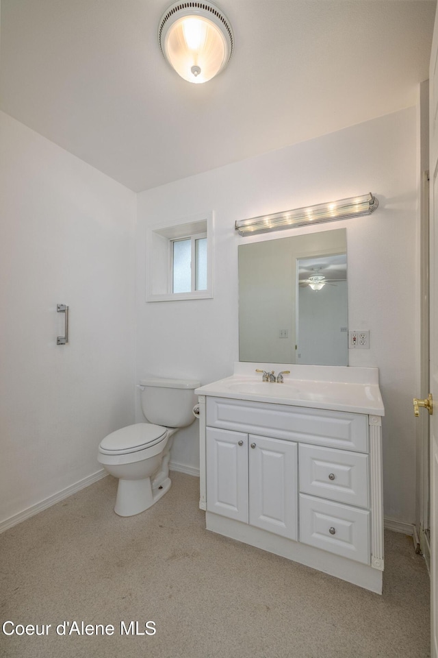 6300 N Sunrise Ter, Coeur Dalene, ID 83815 - bathroom featuring vanity, a ceiling fan, and carpet