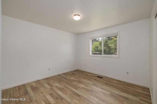6300 N Sunrise Ter, Coeur Dalene, ID 83815 - spare room with light wood-style flooring
