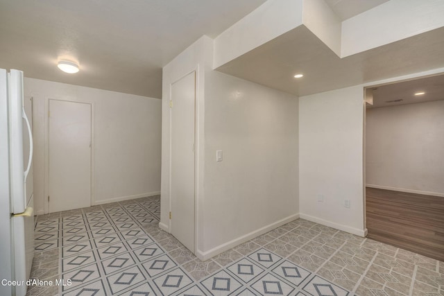6300 N Sunrise Ter, Coeur Dalene, ID 83815 - basement with freestanding refrigerator, light tile patterned floors, and recessed lighting