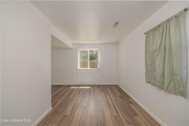 6300 N Sunrise Ter, Coeur Dalene, ID 83815 - empty room with wood finished floors and baseboards