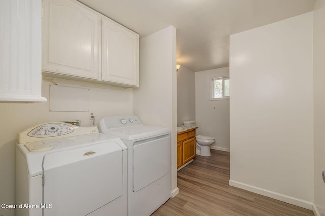 6300 N Sunrise Ter, Coeur Dalene, ID 83815 - laundry room featuring independent washer and dryer and light wood-style floors