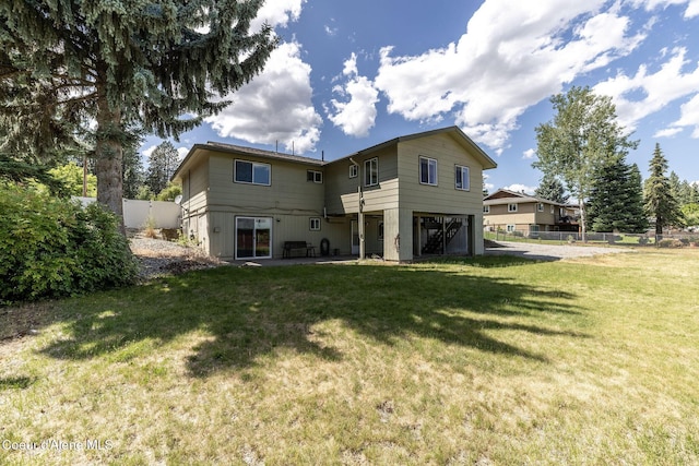 6300 N Sunrise Ter, Coeur Dalene, ID 83815 - rear view of house with an attached garage and a patio