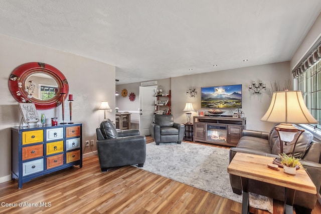 709 E 14th Ave, Post Falls, ID 83854 - living room featuring wood finished floors and baseboards