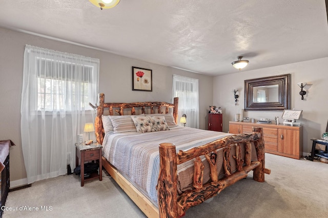 709 E 14th Ave, Post Falls, ID 83854 - bedroom with light colored carpet and baseboards