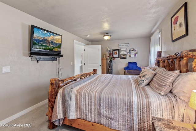 709 E 14th Ave, Post Falls, ID 83854 - carpeted bedroom featuring baseboards
