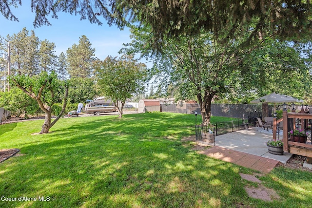 709 E 14th Ave, Post Falls, ID 83854 - view of yard featuring a patio