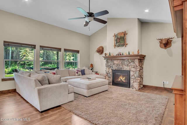 20770 N Penobscot Rd, Rathdrum, ID 83858 - living area featuring a ceiling fan, high vaulted ceiling, a stone fireplace, light wood-style floors, and recessed lighting