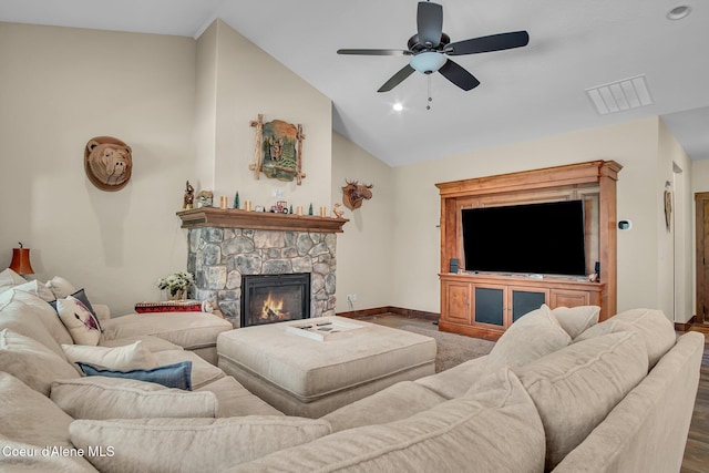 20770 N Penobscot Rd, Rathdrum, ID 83858 - living area with ceiling fan, vaulted ceiling, and a stone fireplace
