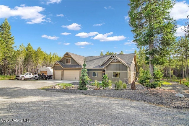 20770 N Penobscot Rd, Rathdrum, ID 83858 - craftsman-style house with concrete driveway, board and batten siding, and an attached garage