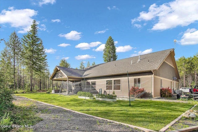 20770 N Penobscot Rd, Rathdrum, ID 83858 - rear view of property with a yard