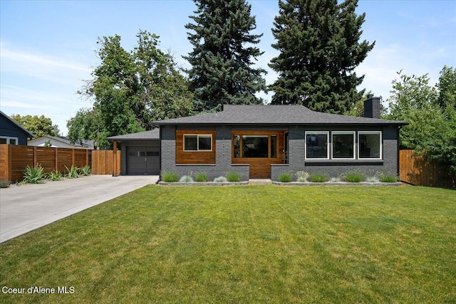 1217 E Montana Ave, Coeur Dalene, ID 83814 - view of front of property featuring concrete driveway, a chimney, a garage, and brick siding