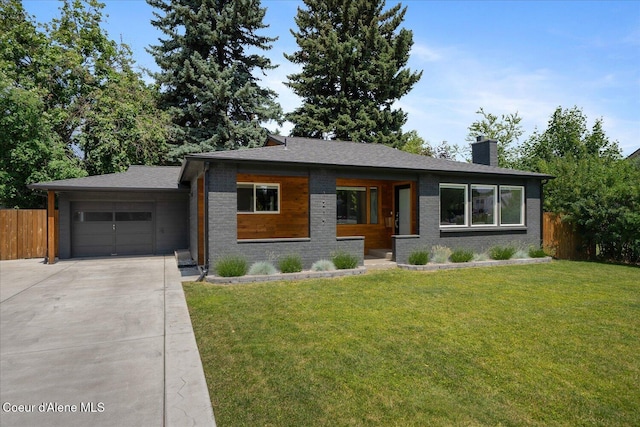 1217 E Montana Ave, Coeur Dalene, ID 83814 - prairie-style home with driveway, a garage, a chimney, and brick siding