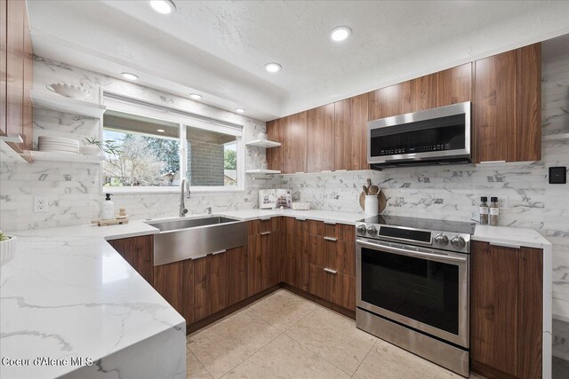 1217 E Montana Ave, Coeur Dalene, ID 83814 - kitchen with appliances with stainless steel finishes, open shelves, modern cabinets, decorative backsplash, and recessed lighting