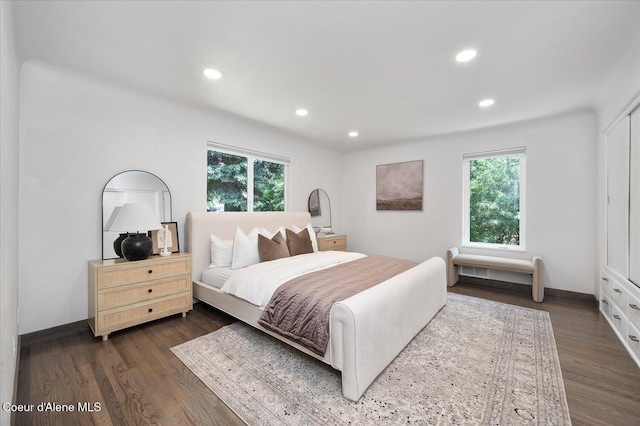 1217 E Montana Ave, Coeur Dalene, ID 83814 - bedroom with multiple windows, recessed lighting, and dark wood finished floors