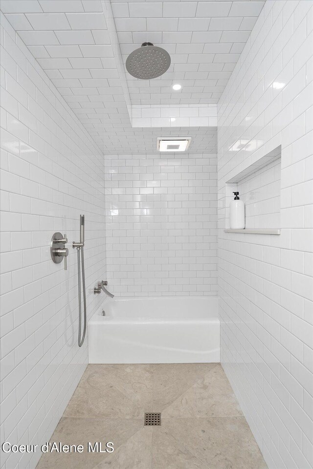 1217 E Montana Ave, Coeur Dalene, ID 83814 - bathroom with tiled shower, tile patterned floors, and tile walls