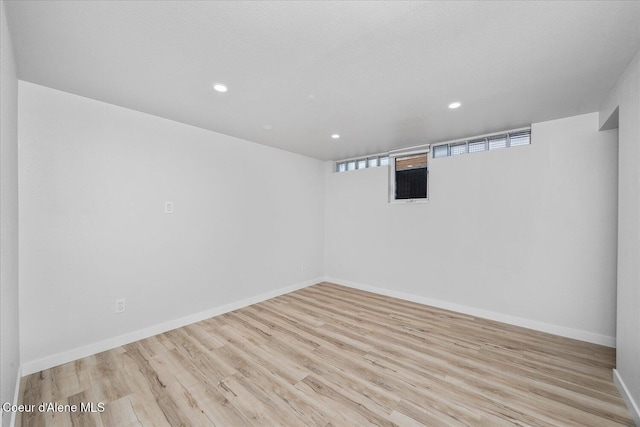 1217 E Montana Ave, Coeur Dalene, ID 83814 - below grade area featuring wood finished floors and recessed lighting